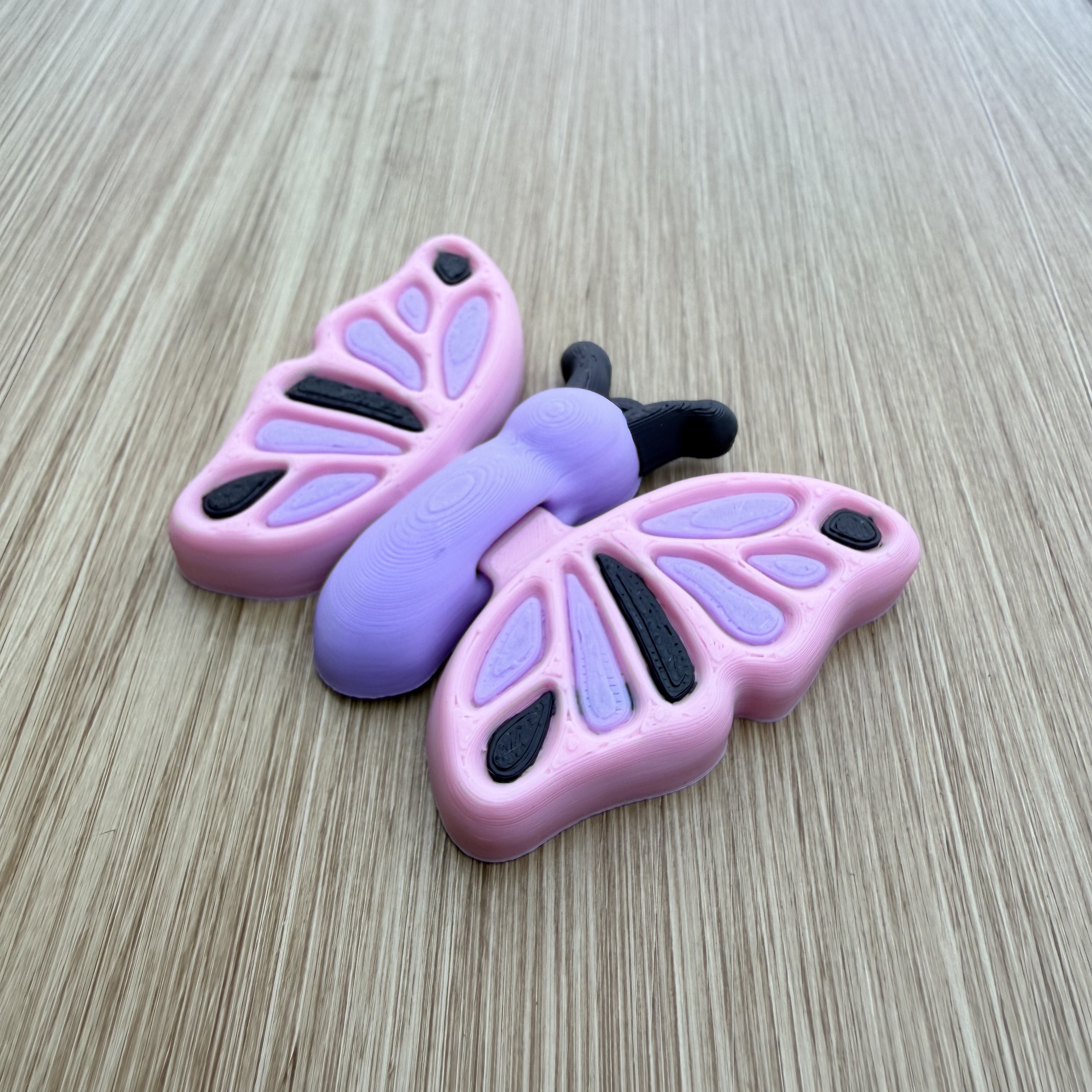 Papillon flexi Rose et mauve, Figurine
